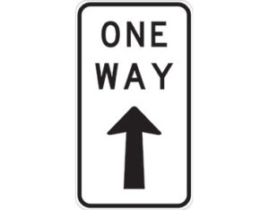 One way sign - text ONE WAY with north pointing arrow - road sign